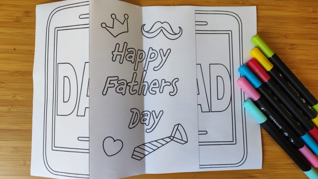 DIY Father’s Day card coloring page opened to reveal “Happy Father’s Day” with crown, mustache, heart, and tie illustrations.